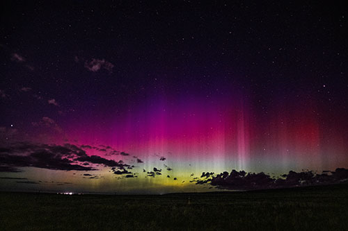 Northern Aurora Borealis Lights Up Night Sky (Orange Tint Photo)