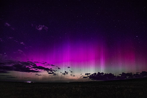Northern Aurora Borealis Lights Up Night Sky (Pink Tint Photo)