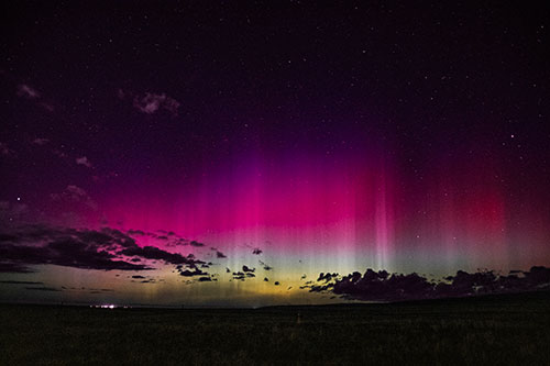 Northern Aurora Borealis Lights Up Night Sky (Red Tint Photo)